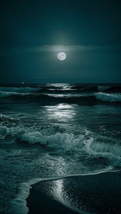 the moon is shining over the ocean with waves