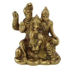 two gold colored statues sitting on top of each other with their hands in the air