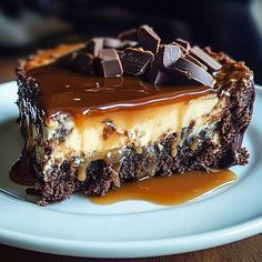 a piece of chocolate cheesecake on a plate with caramel drizzles