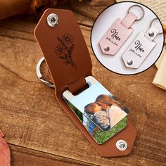 a couple's personalized leather keychain with two photos attached to it