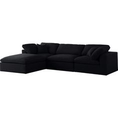 a black sectional couch with pillows on it's back and the seat folded out