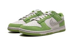 The Nike Dunk Low “Safari Swoosh - Chlorophyll” is a colorway of the vintage basketball sneaker with head-turning safari print on its design.  Certainly one of the most creative Dunk colorways released in 2023, this “Safari Swoosh” edition in Chlorophyll green features Nike’s popular Safari patterning on the leather Swoosh on the sides.  The base of the shoe is designed in Light-Ore-colored leather while the suede overlays are displayed in a green hue dubbed Chlorophyll.  A grey “Nike” logo is e Dunk Colorways, Safari Pattern, Low Dunks, Dunk Low Nike, Vintage Basketball, Safari Print, Dunks Nike, Stadium Goods, Sb Dunk