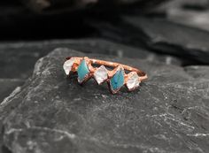 a close up of a ring on a rock