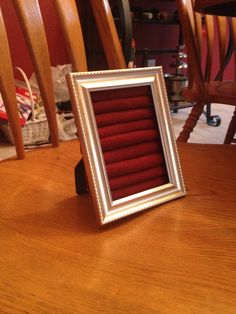 a frame sitting on top of a wooden table