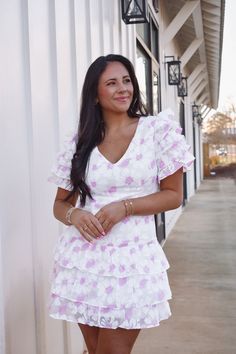 White dress featuring a pink floral print throughout, a V neckline, ruffled sleeves, and a ruffled bottom hem! Back zipper closure Lined 55% Cotton, 45% Polyester Model is 5'4" with a 34" bust, wearing a size medium, runs small size recs: 0-2 S, 4-6 M, 6-8 L- if between sizes order up Blush Dress, Floral Ruffle Dress, Blush Dresses, Pink Floral Print, Ruffled Sleeves, Floral Ruffle, Waist Dress, Ruffle Dress, Pink Floral