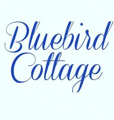 the words bluebird cottage written in cursive writing