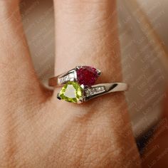 This ring features 6*6 mm trillion cut peridot and lab ruby. Customization is available. It is made by hand, and it will take about 7 days to finish the ring after your payment is completed. Main stone: 6*6 mm trillion cut peridot and lab ruby Main stone weight: 0.95ct(ruby), 0.80(peridot) Metal type: sterling silver /14k gold Accent stone: cz Customization is available, just fee free to contact me, it is free to engrave inside the ring, it is free, you can leave a ntoe with your order, but it w Original Engagement Rings, Memorial Ring, Silver Engagement Ring, Engagement Ring For Women, Alexandrite Ring, London Blue Topaz Ring, Gold Accent, Cz Diamond, Blue Topaz Ring