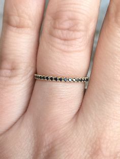 "- BLACK DIAMOND 3/4th Eternity Pave Band/ Anniversary Band/ Wedding Band/ Stackable Ring/ Matching Wedding Band MaterialGold (14K & 18K) or PLATINUM FinishingHigh Polished/ Shiny PlatingRhodium (only if WHITE gold) FitComfort/ Rounded Interior Width1.6 mm Height1.6 mm SettingU Micro Pave Set (Reminds the Letter \"U\" from sides) StonesGenuine Diamonds ColorBlack QualityAAA Total Caratapx 0.40 This Ring is Full of Elegance and Beauty! It is so Simple and so Complete at the same time! One can Black Round Eternity Band For Anniversary, 14k Gold Black Round Band Jewelry, Black Eternity Band For Anniversary, Black 14k Gold Round Band Jewelry, Black 14k Gold Band, Black Diamond Ring With Vvs Clarity In 14k Gold, Black 14k Gold Ring With Prong Setting, Black 14k Gold Rings With Prong Setting, Elegant Black Eternity Band For Anniversary