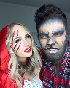 two people with painted faces pose for a photo while dressed as the wolf man and woman