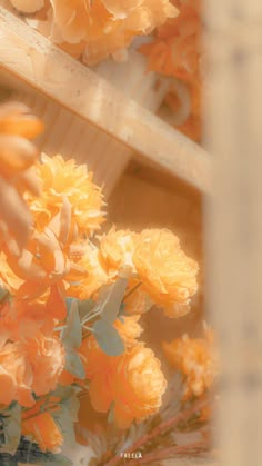 a vase filled with yellow flowers sitting on top of a table