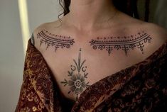 a woman with a tattoo on her chest