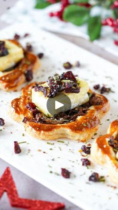 three small pastries on a white plate with christmas decorations in the background and red star