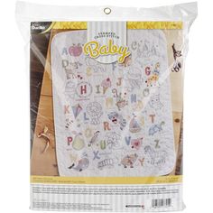 an image of a baby blanket with animals on the front and letters on the back