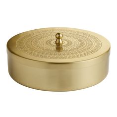 a round metal box with an intricate design on the front and bottom, in gold