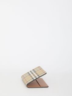 Passport holder in Burberry Check fabric in the shades of beige with smooth calfskin lining. It features four card slots and two slip pockets.Dimensions: 13,5x10cmSize nationality: UNI Product number: 1010347 Product code: 8073975A7026 Composition: 71% polyurethane, 16% polyester, 12% cotton, 1% acrylic Classic Beige Wallet With Rfid Blocking, Classic Beige Rfid Blocking Wallet, Classic Beige Leather Wallet, Luxury Leather Beige Card Holder, Luxury Beige Leather Card Holder, Designer Beige Wallet With Interior Card Slots, Designer Beige Wallets With Interior Card Slots, Designer Brown Card Holder For Formal Use, Designer Brown Card Holder For Formal Occasions