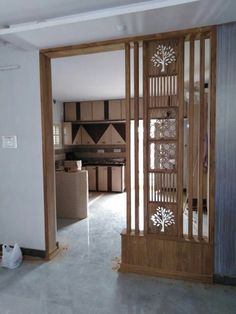 an open door leading to a kitchen and living room