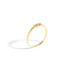 The Princess Ring is pure and simple elegance with three crystal center stones. Wear it into a stackable set for a pop of chic or on its own for very minimal touch. Materials: 14K Gold Plated Brass Silver Plated Brass Crystal Stone Hypoallergenic and Nickel FreeSize: US 6This item comes with a one-year warranty.Greeting card and/or gift receipt for exchange is available with purchase at checkout. Elegant Three Stone Stackable Rings, Classic Gold Three Stone Stackable Rings, Classic Gold Stackable Three Stone Rings, Gold Stackable Three-stone Rings For Promise, Gold Stackable Three Stone Rings For Promise, Elegant Gold Three-stone Crystal Ring, Elegant Gold Three Stone Crystal Ring, Yellow Gold Three Stone Stackable Promise Rings, Minimalist Three Stone Jewelry