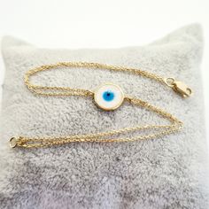 - Evil Eye Mother of Pearl Bracelet for Women is made with high quality 14K real solid gold . -We have listed a necklace with the same design. https://www.etsy.com/listing/937997647/evil-eye-mother-of-pearl-necklace-for - Circle bracelet is with decorated mother of pearl . Its diameter is 1 cm(0.39 inch) - 14K cute, charm, dainty, delicate, elegant Evil Eye Mother of Pearl Necklace is also called Turkish nazar protection, lucky, good luck, Greek eye bracelet . - You receive evil eye mother of pe 14k Yellow Gold Bracelet Gift, Gift 14k Yellow Gold Bracelet, Hypoallergenic Yellow Gold Charm Bracelet, Gold Plated Round Bracelet, Hypoallergenic Gold Plated Bracelets, Hypoallergenic Gold-plated Bracelet, Gold-plated White Gold Bracelet For Gift, 14k White Gold Bracelets As Gift, 14k Yellow Gold Bracelet As Gift