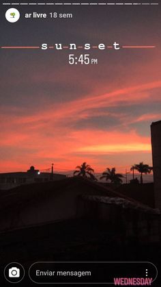 the sun is setting over some buildings and palm trees