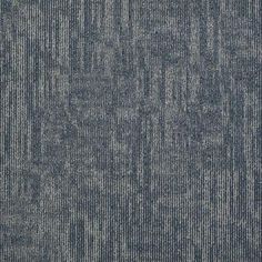 an upholstered blue and grey carpet with vertical lines in the middle, as well as horizontal stripes