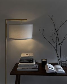 a lamp and some books on a table