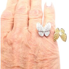 Van Cleef & Arpels 18k Gold Diamond Sapphire Two Butterfly Between Finger Ring      This ring comes with VCA box and a VCA certificate of authenticity.   Metal: 18k White Gold  Size: European 50, US 5 1/4  Weight: 8.3 grams  Width; 20mm  Stones: 36 round brilliant cut diamond VVS1 clarity, E color total weight .99ct 34 round yellow sapphires total weight .88ct  Hallmarks: Cartier 750 50 JX10XXXX (Serial Omitted) T3357maodd  Dimensions reference the ring size and are not specific to the ring itse Luxury Butterfly Ring With Brilliant Cut - Gift, Luxury Butterfly Ring With Brilliant Cut For Gift, Luxury Butterfly Ring With Brilliant Cut, Brilliant Cut White Gold Butterfly Ring For Gift, Luxury Gold Butterfly Ring For Anniversary, Formal Yellow Gold Butterfly Ring With Cubic Zirconia, Gold Luxury Butterfly Ring For Formal Occasions, Luxury Gold Butterfly Ring For Formal Occasions, Luxury Diamond Butterfly Ring In Yellow Gold