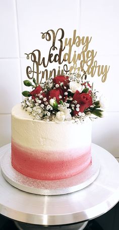 a wedding cake with red and white frosting