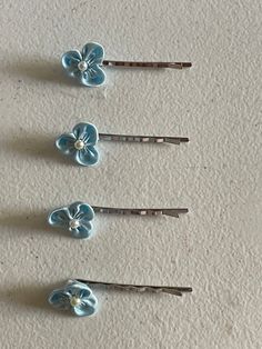 "THIS LISTING IS FOR ONE PAIR (two pieces), YOU MAY ADD MORE TO YOUR CART TO BUY MORE. A beautiful blue flower hair embellishment on a silver tone bobby pin. Perfect for just a touch of bling To hold bangs swept to the side nicely with this unique hair jewelry, or to embellish your up do Embellishment: dimensions: 1\" x 1\" = 2.5 cms Bobbie pin: 2'' or alligator clip; please write selection in the buyers notes; If, no selection is made, alligator clips will be sent by default. Color: Silver tone Flower Girls Hair, Pink Low Heels, Blue Hair Pins, Blue Wedding Hair, Aesthetic Era, Blue Hair Accessories, Light Blue Flowers, Unique Hair, Flower Girl Hairstyles