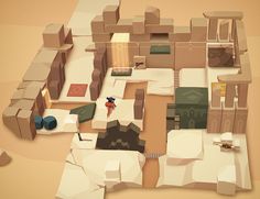 an aerial view of a desert town with lots of boxes on the ground and people walking around