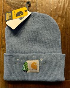 a beanie hat with a sticker on it