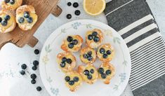 blueberries and lemon pastries on a white plate