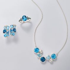 Ross-Simons - 9.60ct t. w. Tonal Blue, White Topaz Bezel Necklace in Silver. 20". Invigorate your look with cool, tonal shades in bright sterling silver bezels. On a cable chain, this necklace stations 9.00 ct. t. w. of Swiss, sky, and London blue topaz with .60 ct. t. w. white topaz. Crafted in polished sterling silver. Springring clasp, white and blue topaz necklace. Blue Topaz birthstones are the perfect gift for December birthdays. Modern Blue Topaz Blue Jewelry, Dazzling Blue Jewelry With Gemstone Accents, Dazzling Blue Jewelry With Gemstones, Modern Blue Jewelry With Gemstone Accents, Modern Blue Faceted Jewelry, Modern Blue Jewelry With Accent Stones, Topaz Birthstone, Bezel Necklace, December Birthday