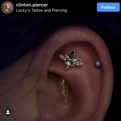 an ear piercing with two different colored stones