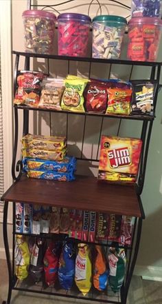 a shelf filled with lots of food next to a door