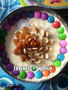 there is a cake decorated with candies and a flower