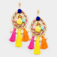 two pairs of colorful earrings with tassels and beads on the front, one is gold