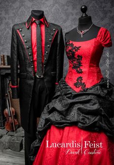 a red and black wedding dress on display next to a man in a tuxedo