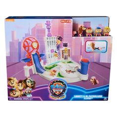 the paw patrol city playset is in its box and has all kinds of toys