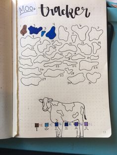 a notebook with an image of a cow and the words moo bloker on it