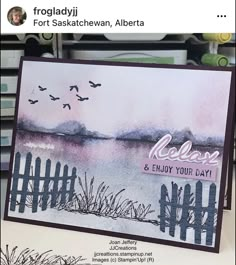 a card with watercolors on it that says relax and enjoy your day in front of a lake