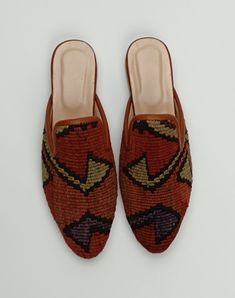 Welcome to AliDesignStore This Kilim Mules one -of-A-kind! Upper Made of a Hand-Selected Vintage Turkish Kilim Rug .  Kilims Rugs Are Hand Crafted From Vegetable Yarn. Have Stronger weave. - Handcrafted - Materials : Handwoven Kilim Rug                       Leather Sole                        Leather Trimmed                       Leather Lining                       Stacked Leather Sole                       Rubber Under The Stacked Heel  Care:   Soft Clothing Brush İs Recommended To Clean The Traditional Brown Mules With Rubber Sole, Traditional Closed Toe Mules With Woven Sole, Traditional Closed Toe Slippers With Woven Sole, Handmade Bohemian Closed Toe Mules, Traditional Slippers With Woven Sole And Round Toe, Handmade Bohemian Closed Toe Slippers, Elegant Calf Leather Slip-ons With Stitched Sole, Traditional Handmade Flat Mules, Artisan Handmade Slip-on Mules