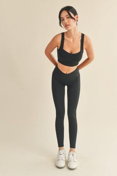 Experience comfort and optimum performance with this Black Under Control Bra & Legging Set. This set features a supportive and compressive fit with bold strappy back detail and high waisted leggings with convenient side pockets. Crafted with durable materials, this set is perfect for a range of workouts. Fabric & fit: 75% Nylon, 25% Spandex Model is wearing size Small. Sporty Workout Leggings With Built-in Bra, Medium Support Elastane Activewear With Built-in Padding, Versatile Micro-elastic Activewear With Built-in Padding, Micro-elastic Activewear With Built-in Bra For Pilates, Recycled Polyester Yoga Activewear With Built-in Padding, Activewear With Built-in Bra In Elastane, Athleisure Activewear With Built-in Padding And Micro-elastic Fit, Yoga Activewear With Built-in Padding, Functional Sports Bottoms With Built-in Bra