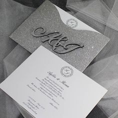 a wedding card with silver glitter on it