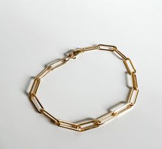 Riley medium chain bracelet is a great choice for those that want the trendy paper clip chain with a slightly lighter look and feel. NOTE: Gold-filled jewelry has a much higher amount of gold in it than gold-plated, making it more valuable (almost 100% more gold than gold-plated jewelry), more durable (won't chip or tarnish), safe for those with metal allergies and longer-lasting (10-30 years). Gold Paperclip Box Chain Bracelet, Minimalist Paperclip Bracelet With Chunky Oval Links, Minimalist Gold Bracelet With Chunky Oval Link, Gold Minimalist Paperclip Bracelet With Box Chain, Minimalist Gold Paperclip Bracelet With Box Chain, Everyday Gold Chain Oval Link Paperclip Bracelet, Everyday Gold Chain Paperclip Bracelet With Oval Links, Everyday Gold Bracelet With Paperclip Link, Gold Chain Paperclip Bracelet For Everyday