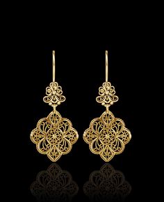 Indulge in the exquisite craftsmanship of these gold-plated 925 sterling silver filigree art flower-shaped women's dangle drop earrings. These stunning earrings are designed with intricate floral details and feature delicate filigree work, creating a stunning visual effect. The earrings measure 1.90 inches in length, 0.90 inches in width, and have a drop length of 0.90 inches. The oxidized finish gives them a unique antique look, and they are highly polished to create a brilliant shine. They com Drop Gold Earrings, Diamond Finger Ring, Pearl Earrings Designs, Gold Jewellry, Art Jewelry Design, Jewelry Drawing, Filigree Jewelry, Silver Lace, Lace Flower