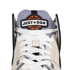 a pair of white and grey sneakers with the words just don written on them