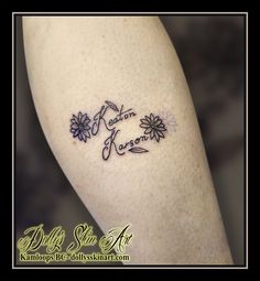 a woman's leg with flowers on it and the words love written in cursive writing