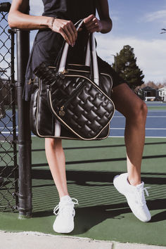 This is more than a bag. It is a versatile companion that seamlessly combines fashion and function. Designed with active women in mind, it features a unique paddle compartment for easy and accessible pickleball equipment storage. The spacious main compartment provides ample room for your essentials and extras, including gym clothes, water bottles, laptop, and more. Elevate your game and experience the perfect fusion of fashion and functionality. Sporty On-the-go Shoulder Gym Bag, Versatile Sports Duffle Bag, Sporty Duffle Bag For Sports, Sporty Bag With Removable Pouch For On-the-go, Athleisure Sports Bag, Sporty Gym Bag, Sporty Shoulder Travel Bag, Sporty Rectangular Gym Bag With Removable Pouch, Sporty Shoulder Gym Bag