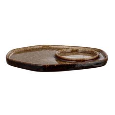 an oval tray with two rings on it