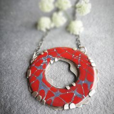 Enamel and silver pendant, contemporary jewel in red and gray, enameled circular pendant for women, handmade necklace, enameled jewelry. Original enamel and silver pendant with a circular shape, in original red and gray autumnal tones, made with liquid enamels vitrified in an enameling oven at temperatures of about 830 degrees Celsius and using sgraffito techniques to make the cracks that characterize this collection. The liquid enamel is applied in light layers, with a brush, dried and subseque Red Enamel Jewelry With Large Pendant, Handmade Red Enamel Necklace, Handmade Red Enamel Necklaces, Red Handmade Enamel Necklaces, Unique Red Enamel Necklaces, Red Enamel Round Necklace, Red Enamel Nickel-free Necklace, Red Enamel Necklace Nickel Free, Red Enamel Nickel-free Necklaces